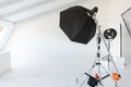 Empty photo studio with lighting equipment. Photographer workplace interior with professional tool set gear. Flash light Royalty Free Stock Photo