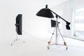 Empty photo studio with lighting equipment. Photographer workplace interior with professional tool set gear. Flash light Royalty Free Stock Photo