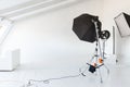 Empty photo studio with lighting equipment. Photographer workplace interior with professional tool set gear. Flash light Royalty Free Stock Photo