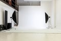 Empty photo studio with lighting equipment. Photographer workplace interior with professional tool set gear. Flash light Royalty Free Stock Photo