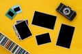 empty photographs frames next to old camera Royalty Free Stock Photo