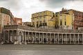 Empty piazza Plebiscite with colonnade in cloudy day. Naples landmark. Italian architecture. Royalty Free Stock Photo