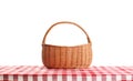 Empty picnic basket on checkered tablecloth Royalty Free Stock Photo