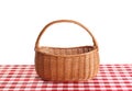 Empty picnic basket on checkered tablecloth Royalty Free Stock Photo