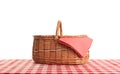 Empty picnic basket on checkered tablecloth Royalty Free Stock Photo