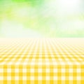 Empty picnic gingham tablecloth, green background Royalty Free Stock Photo
