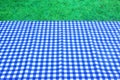 Empty Picnic Table With Blue White Tablecloth Background