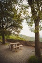 Empty picnic table and chairs in the mountains on a beautiful viewpoint. Royalty Free Stock Photo