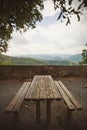 Empty picnic table and chairs in the mountains on a beautiful viewpoint. picnic table at the european mountains. Royalty Free Stock Photo