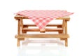 Empty picnic table with tablecloth