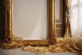 The empty picture frame is adorned with intricate golden silk threads, adding a touch of elegance and sophistication to the Royalty Free Stock Photo