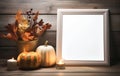 Empty picture frame with autumnal composition