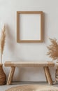 Empty picture frame on a beige wall with natural light in a minimal living space