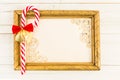 Empty picture frame with Christmas cane candy