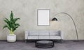 Empty picture frame in loft living room. Picture mockup. Modern interior living room with grey concrete wall, sofa, black lamp Royalty Free Stock Photo