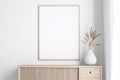 Empty picture frame made of wood Hang on the wall on a wooden cabinet in a bright room 3d render Royalty Free Stock Photo