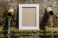 Empty Picture Frame Near Old Weathered Water Fountain
