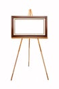 Empty picture frame on wooden easel Royalty Free Stock Photo