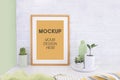 Empty picture mockup with wooden frame on white brick wall background Royalty Free Stock Photo