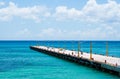 Empty pier for ferries on blue Caribbean sea.