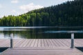 Empty pier on the scenic lake Royalty Free Stock Photo