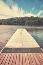 Empty pier with two pairs of worn sport shoes.