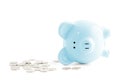 Empty piggy bank and coins on white background Royalty Free Stock Photo