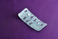 Empty pill blister pack on a Purple background