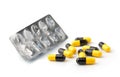 Empty pill blister and pills capsules on white backgrou