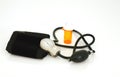 Empty pill bottle with blood pressure manometer Royalty Free Stock Photo