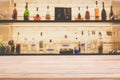 Empty pine wooden bar counter with blur background bottles of re Royalty Free Stock Photo