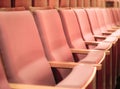 Empty pink chairs in conference hall or theater. Royalty Free Stock Photo