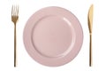 Empty pink plate with golden fork and knife on white background, top view Royalty Free Stock Photo