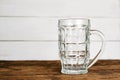 Empty pint lager on wooden table. Royalty Free Stock Photo