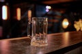 Empty pint lager on wooden table. Copy space Royalty Free Stock Photo