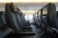 Empty plane cabin seat with green uphostery Royalty Free Stock Photo