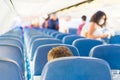 Empty plane interior with few people