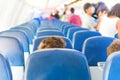 Empty plane interior with few people