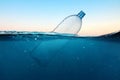 Empty plastic bottle floats in water. Ocean pollution concept. Global warming. View under water. Royalty Free Stock Photo