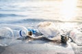 Empty plastic bottles on the beach, seashore and water pollution concept. Royalty Free Stock Photo