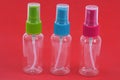 Empty plastic vaporizers close up on red background