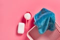 Empty plastic square basket for washing with blue soft towel near antibacterial soap Royalty Free Stock Photo