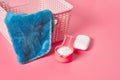 Empty plastic square basket for washing with blue soft towel near antibacterial soap and measuring spoon full of powder Royalty Free Stock Photo