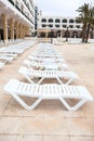Empty plastic sunbeds, sun loungers are in a hotel resort area, hotels are ready for tourists at summer season Royalty Free Stock Photo