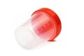 empty plastic urine jar isolated on red background. close up