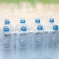 empty plastic water bottles on table - recycling and food storage Royalty Free Stock Photo