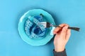 Empty plate with blue measure tape. Diet food concept. Weight loss concept Royalty Free Stock Photo