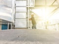 Empty plate with blurred worker and exhaust duct Royalty Free Stock Photo