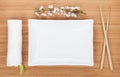 Empty plate, chopsticks and sakura branch Royalty Free Stock Photo