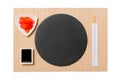 Empty plate with chopsticks for sushi and soy sauce, ginger on brown sushi mat background. Top view with copy space for you design Royalty Free Stock Photo